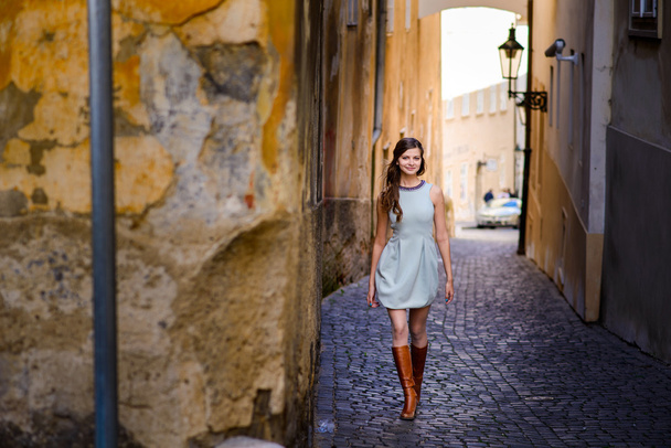 Smiling young long-haired Bohemian girl in Prague. - 写真・画像