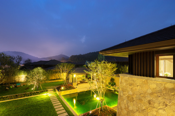 backyard in modern villa in clear sky at night - Photo, Image