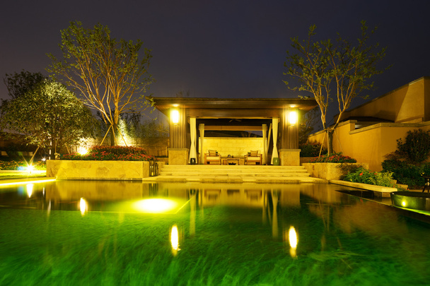 backyard in modern villa at night - Photo, Image