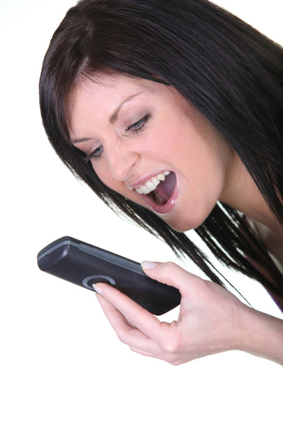 Angry woman shouting on her mobile phone - Foto, Imagen