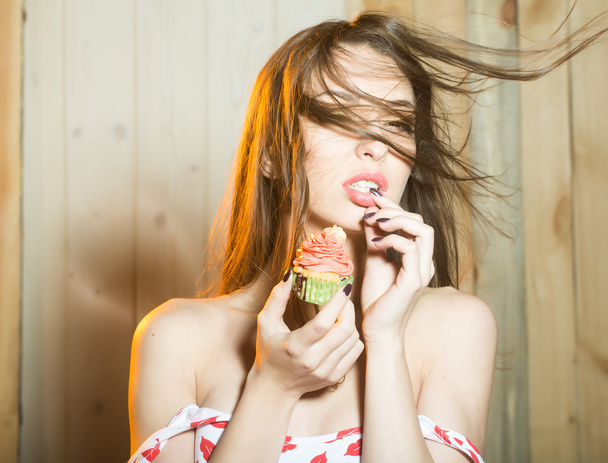 Sensual woman with cupcake - Zdjęcie, obraz