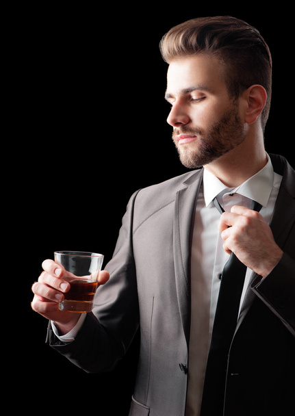 Businessman holding a glass - Fotoğraf, Görsel