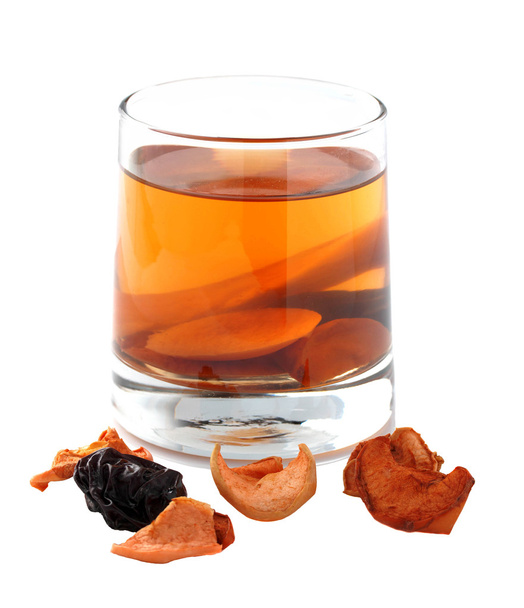 Assorted dried fruit compote in a glass on a white background. I - Photo, Image