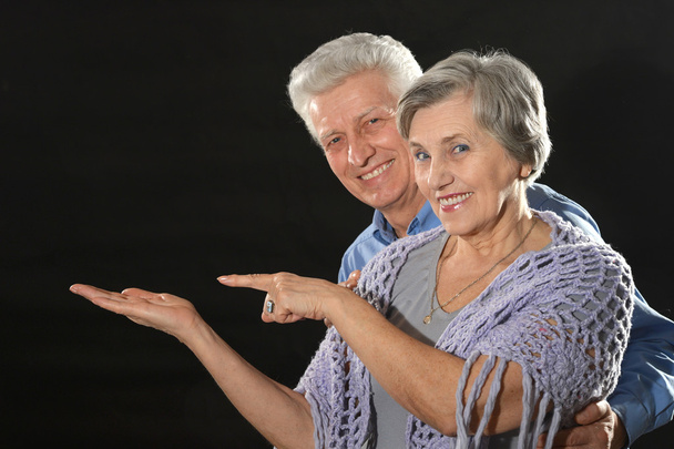 elderly couple advertising products - Фото, изображение