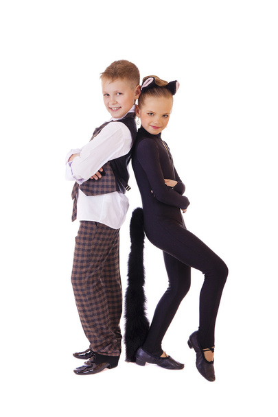 Dancing little girl dressed as a cat and a boy in a plaid vest - Photo, Image