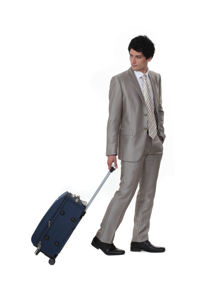 A businessman leaving on a business trip - Foto, Imagen