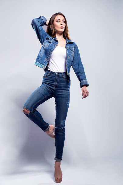 Young sexy woman in jeans jacket, white shirt - Fotoğraf, Görsel