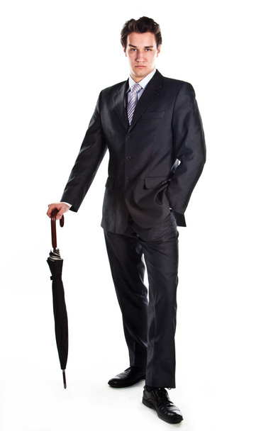 Business man with an umbrella - Foto, afbeelding