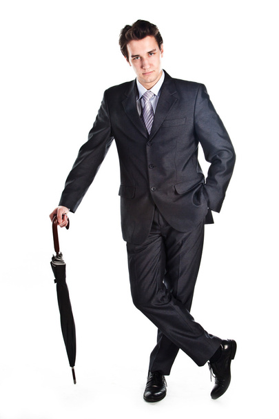 Business man with an umbrella - 写真・画像