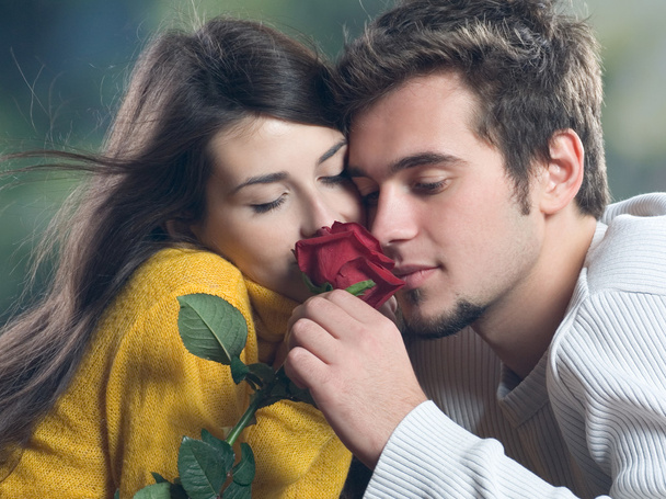 Couple with rose outdoors - Photo, Image