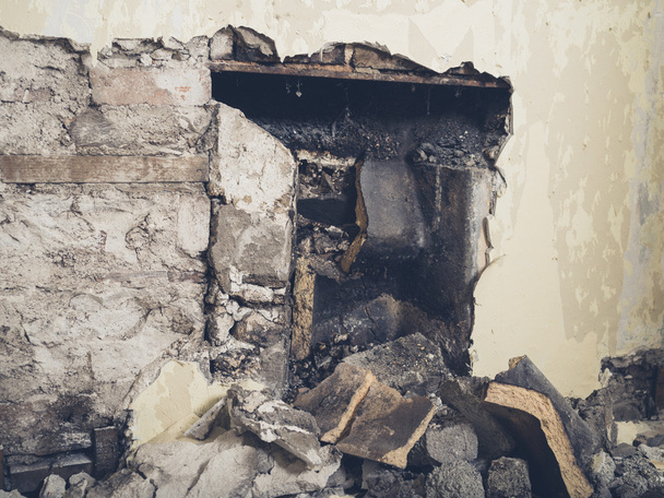 Demolished fireplace in a house - Photo, image