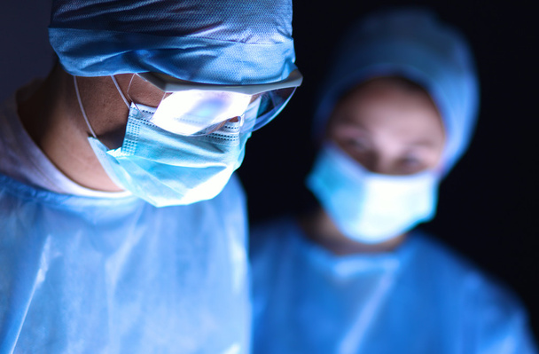 Team surgeon at work in operating room. - Foto, Imagen