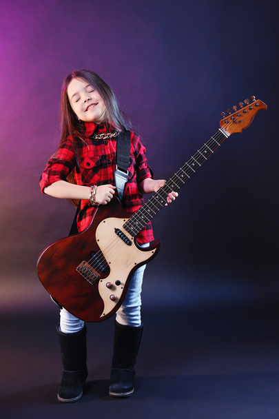 Little rock star playing guitar  - Photo, image