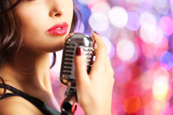 Young cute woman with retro microphone - Foto, immagini