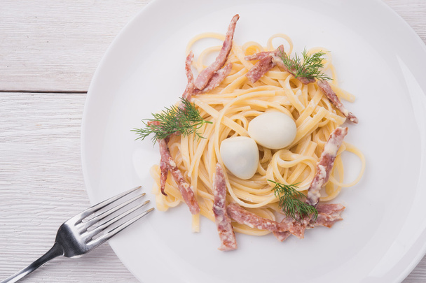 Pasta with bacon and dill - 写真・画像