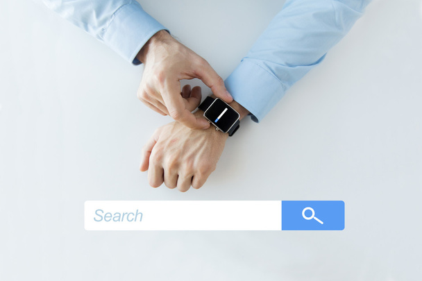 hands with internet browser search on smartwatch - Φωτογραφία, εικόνα