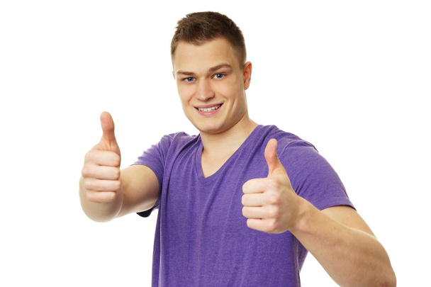 Young man showing thumbs up - Photo, Image