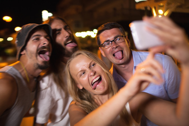 Young people taking crazy selfie with mobile - Photo, Image
