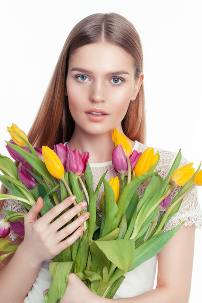 young girl holding tulips - Фото, изображение