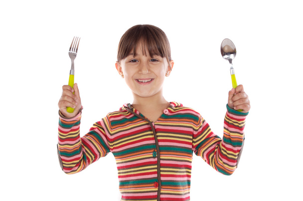 αξιολάτρευτο κορίτσι με πιρούνι και κουτάλι έτοιμες στο μεσημεριανό γεύμα - Φωτογραφία, εικόνα
