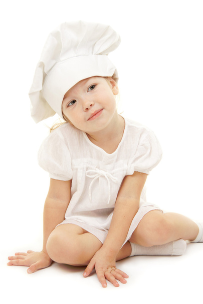 Baby girl in the cook hat - 写真・画像