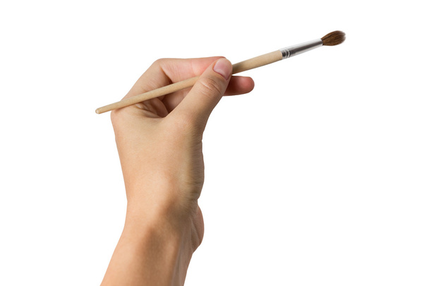 Female hand with brush isolated on white background - Photo, Image