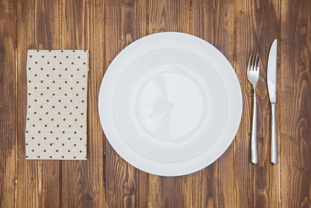 Knife, fork, napkin and dinner plate - Foto, Bild