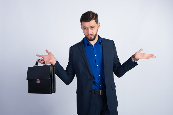 Young businessman with a leather briefcase - Фото, зображення