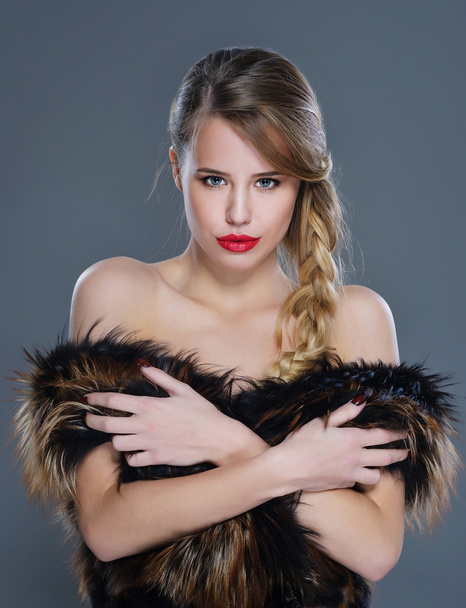 Woman fashion portrait in fur clothing - Фото, изображение