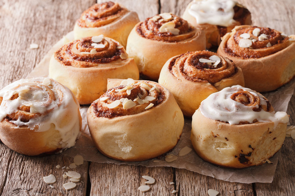 Delicious Cinnabon with almond close up. Horizontal - Photo, Image