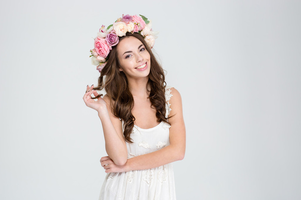 Smiling woman in dress and wreath of roses - Foto, imagen