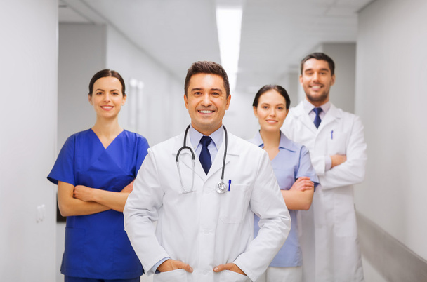 happy group of medics or doctors at hospital - 写真・画像