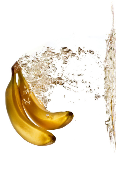bananas flying into the water - Фото, зображення