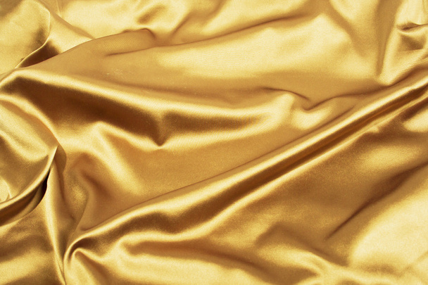 Golden satin or silk background, luxury elegant - Foto, afbeelding