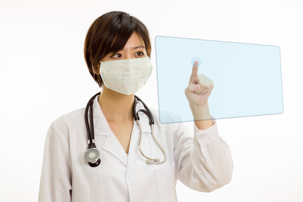 Asian female doctor pressing virtual button - Fotó, kép