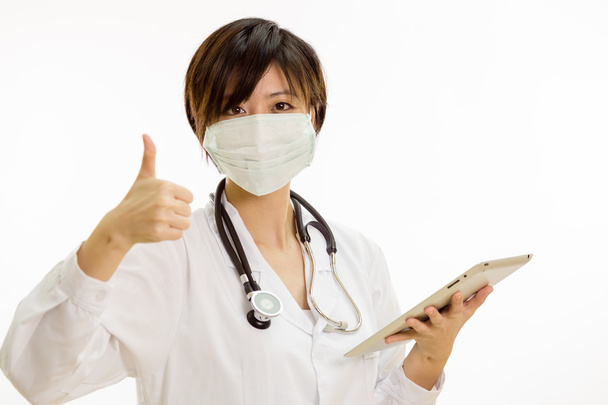 Asian female doctor with tablet computer, thumbs-up - 写真・画像