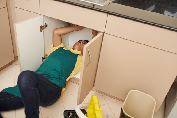 Man Fixing sink - Photo, Image