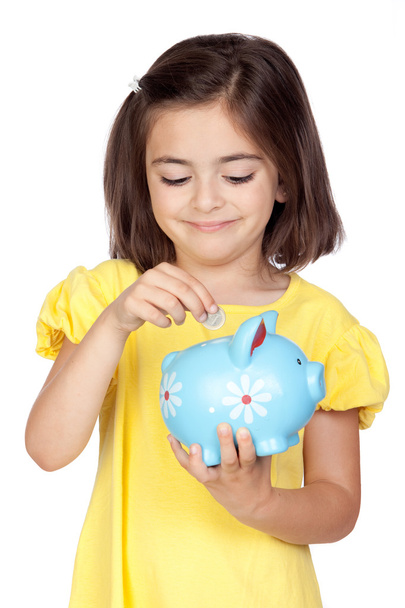 Bruna bambina con un moneybox blu
 - Foto, immagini