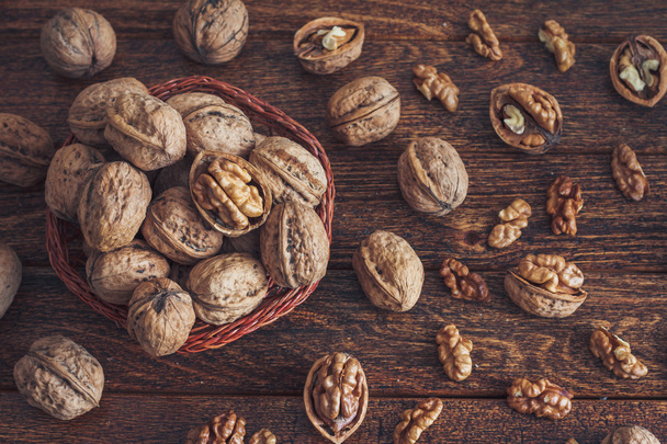Walnuts on wooden background - Photo, Image