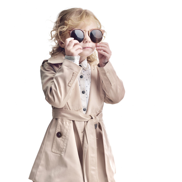 Fashionable child. Girl blonde with glasses - Foto, afbeelding