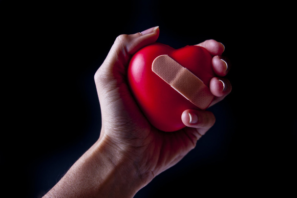 Hand Holding a Broken Heart - Photo, Image