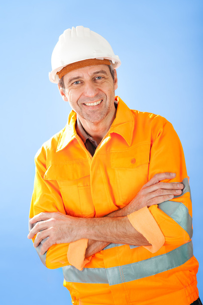 Senior construction worker on sky - Фото, зображення