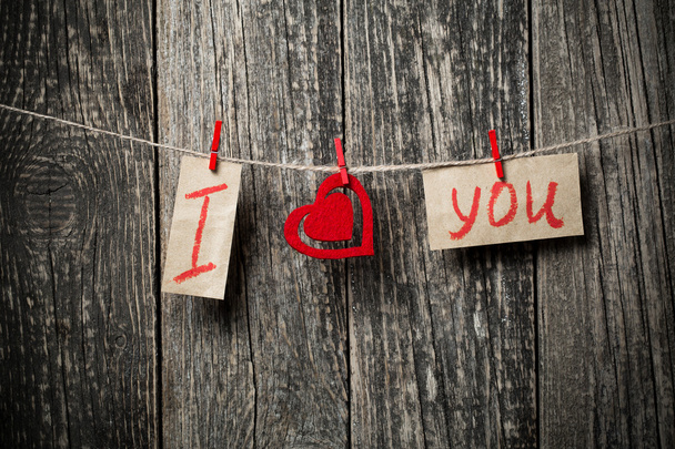 Handwritten words I love you and hearts on wooden background. - Φωτογραφία, εικόνα