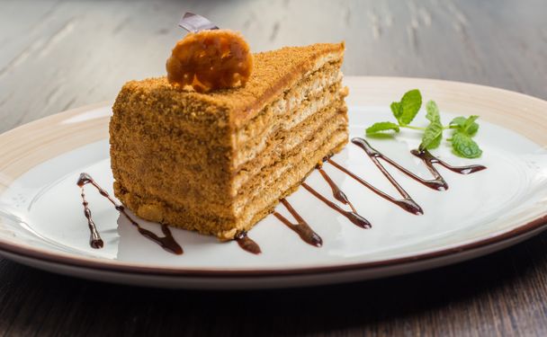 Slice of layered honey cake - Фото, зображення