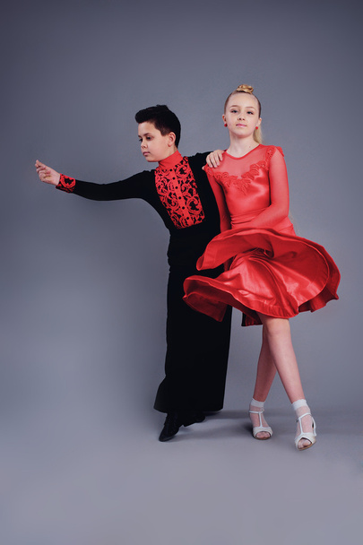 Two beautiful children dancing ballroom dance sport - Foto, Bild