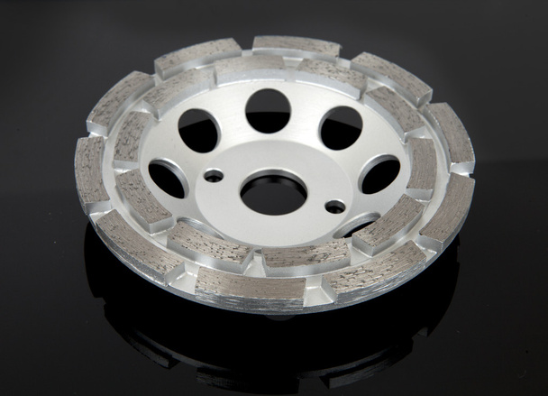 Cutting disk with diamonds - Diamond disc for concrete on the black background - Photo, Image