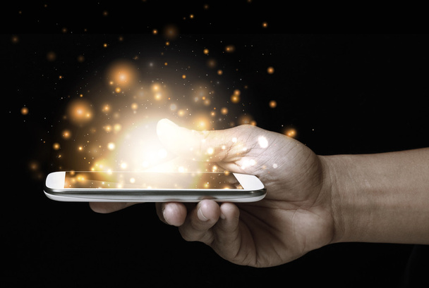 Gold magic stars light on smartphone - Фото, зображення