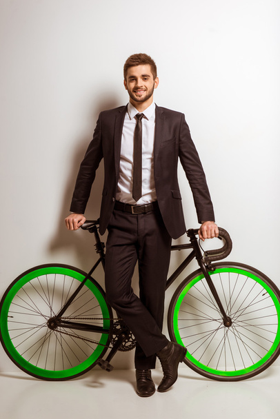 Young businessman with bicycle - Φωτογραφία, εικόνα