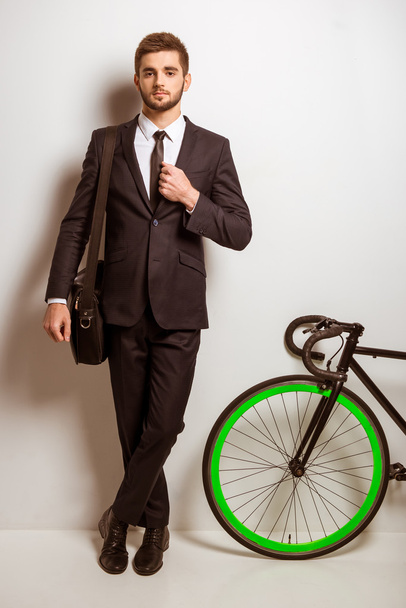 Young businessman with bicycle - Photo, image