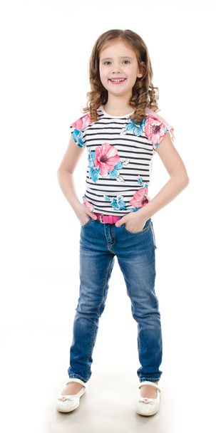 Cute smiling little girl in jeans isolated - Fotografie, Obrázek
